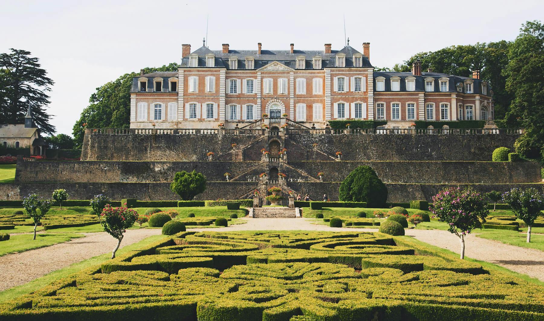 Stately chateau with garden and gates