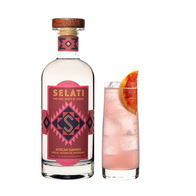 Bottle and glass with non-alcoholic drink African Summer by Selati
